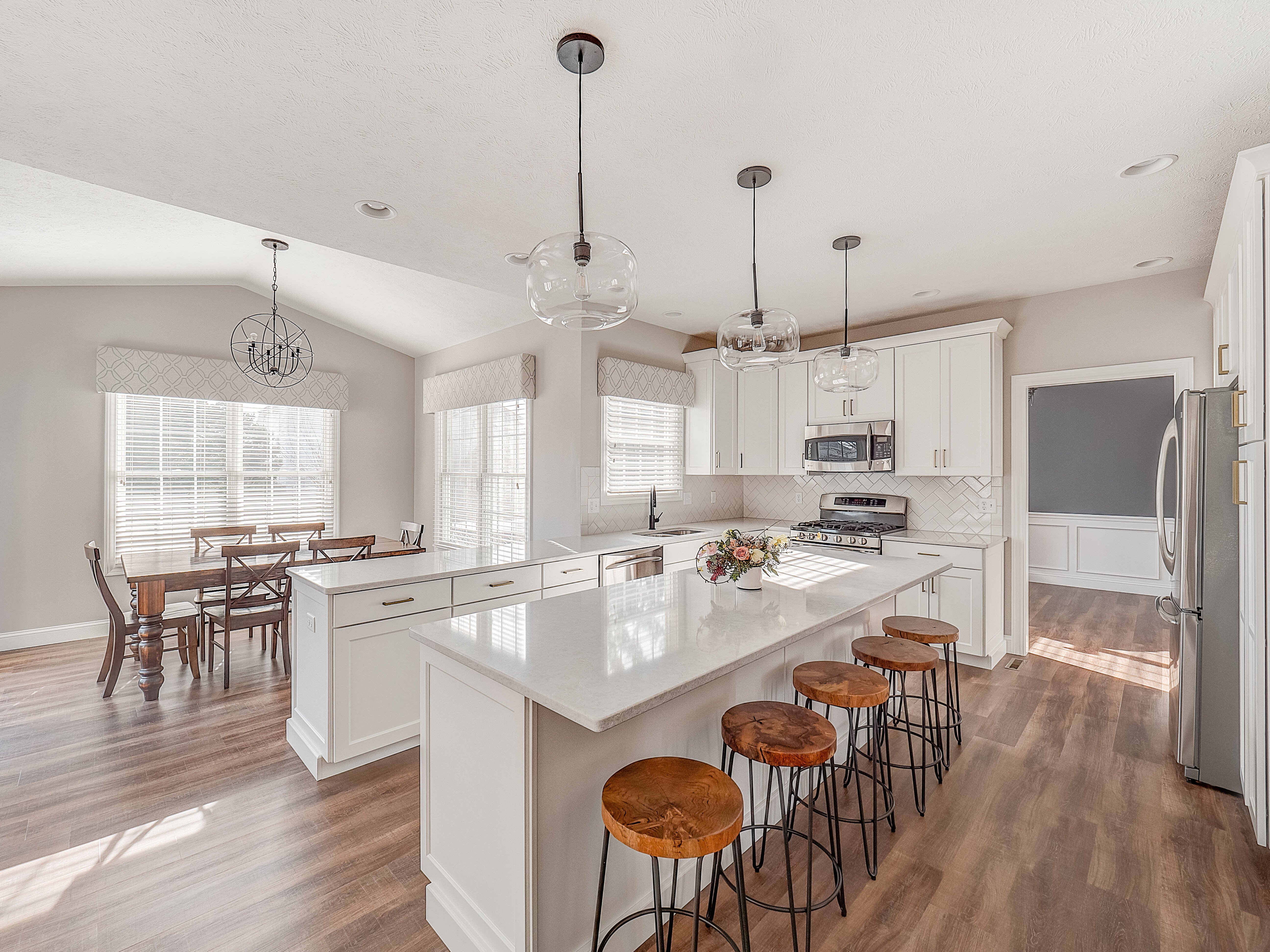 Kitchen remodel with kitchen island seating and open dining area
