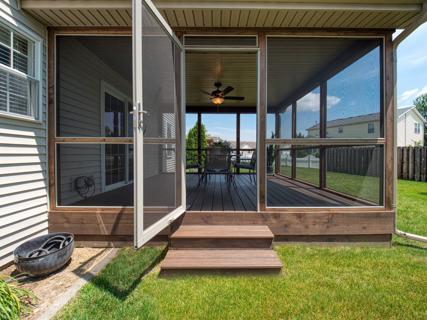 backyard porch addition with open screen door by Landmark Construction in Bloomington, IL-optimized