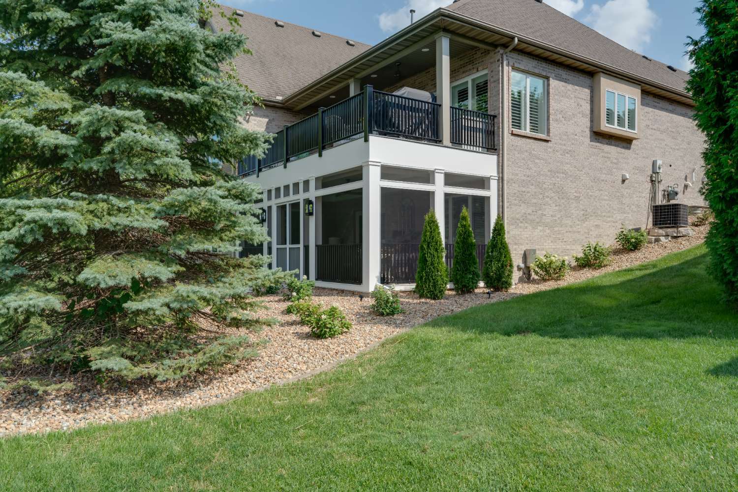elevated deck and screened porch exterior by Landmark Construction in Bloomington, IL-optimized