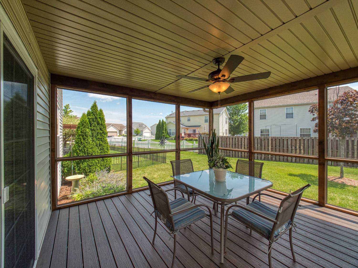 screened porch interior with dining set by Landmark Construction in Bloomington, IL-optimized screened porch interior with dining set by Landmark Construction in Bloomington, IL-optimized